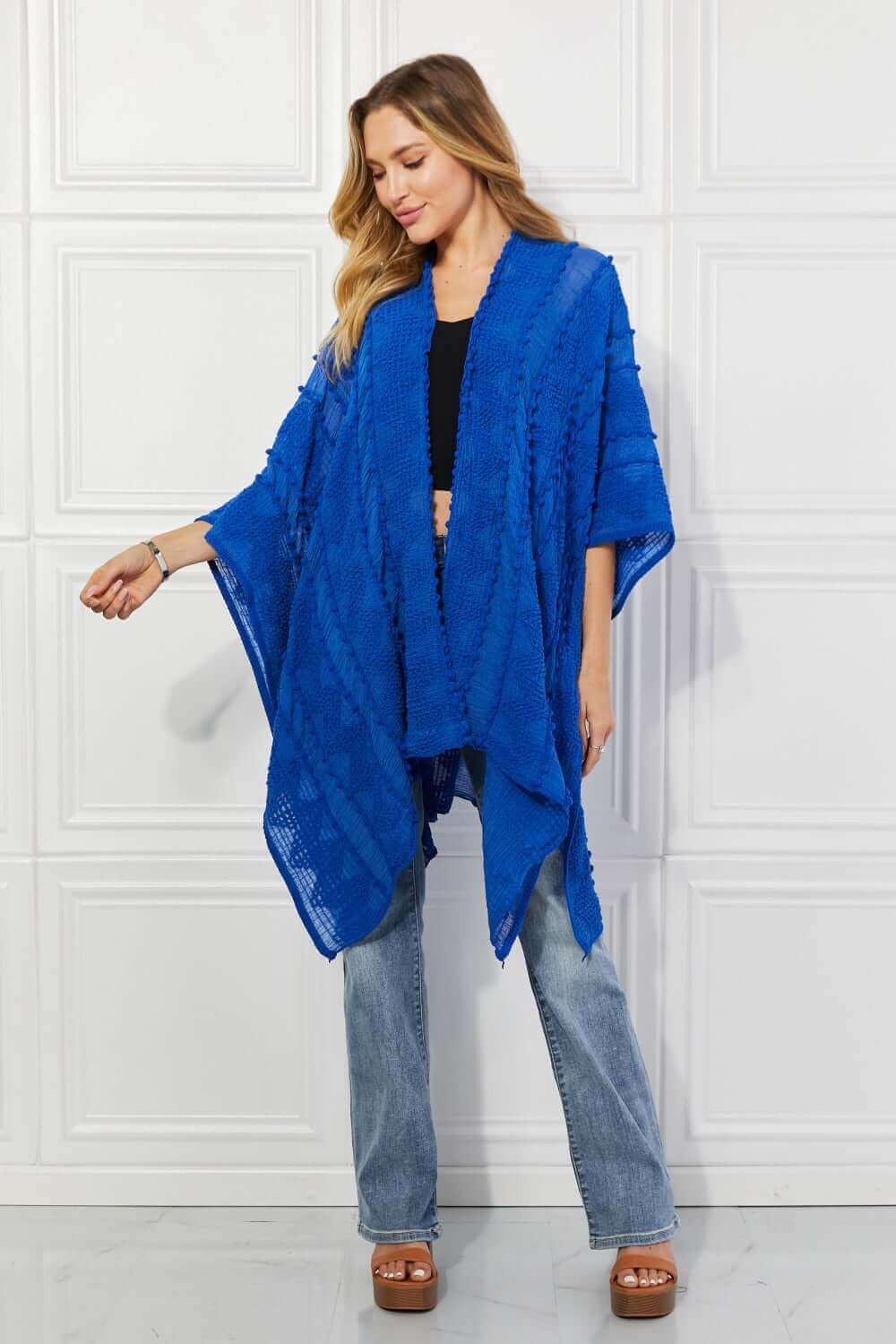 JUSTIN TAYLOR Pom-Pom Asymmetrical Poncho Cardigan in Blue at Bella Road