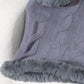 Cozy gray cable-knit poncho with fuzzy hem, perfect for stylish warmth on chilly days.