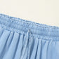 Close-up of the drawstring waist on Bella Road wide leg jeans in medium blue, showcasing comfort and style.