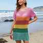 Model wearing Bella Road Swim Openwork Cover-Up with rainbow stripes at the beach, showcasing a fun summer style.