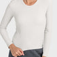 Model wearing a Millennia Round Neck Long Sleeve Sports Top in light color, showcasing a stylish and comfortable fit for workouts.