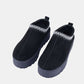 Platform slip-on boots with embroidered trim and thick soles, perfect for stylish and comfortable daily wear or nights out.