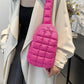 Trendy pink Bella Road Quilted Nylon Crossbody Bag worn by a person, showcasing its stylish and lightweight design.