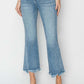 Trendy high rise frayed hem flare jeans, Risen Jeans, offer a stylish and elongating silhouette with a touch of bohemian charm.