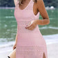 Woman in a dusty pink openwork scoop neck cover-up on the beach, showcasing a stylish summer look.