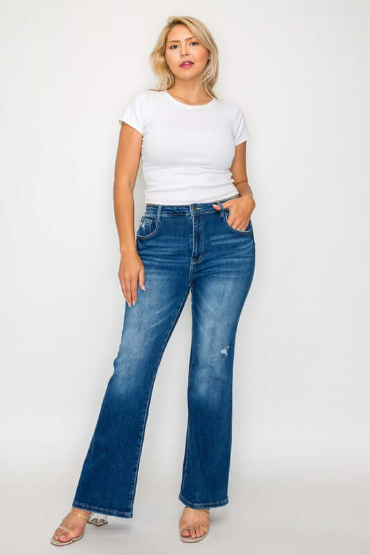 Woman wearing bytos full size high rise bootcut jeans with pockets and a white t-shirt, showcasing a stylish casual look.