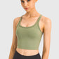 Millennia Racerback Sports Bra in olive green, showcasing a sleek design ideal for yoga and workouts.