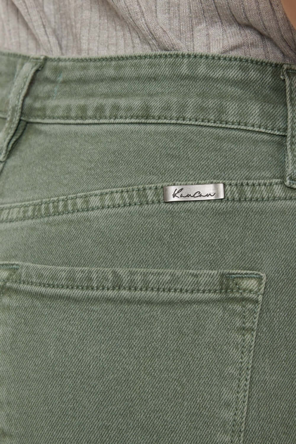 Close-up of Kancan ultra high-rise olive jeans with back pocket detail.