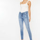 Woman wearing High Waist Cat's Whiskers Skinny Jeans with classic denim wash and distressed details, showcasing fashionable high-waist design.