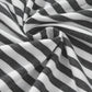 Close-up of Bella Road striped fabric with black and white stripes, showcasing the stylish pattern of the round neck long sleeve top.