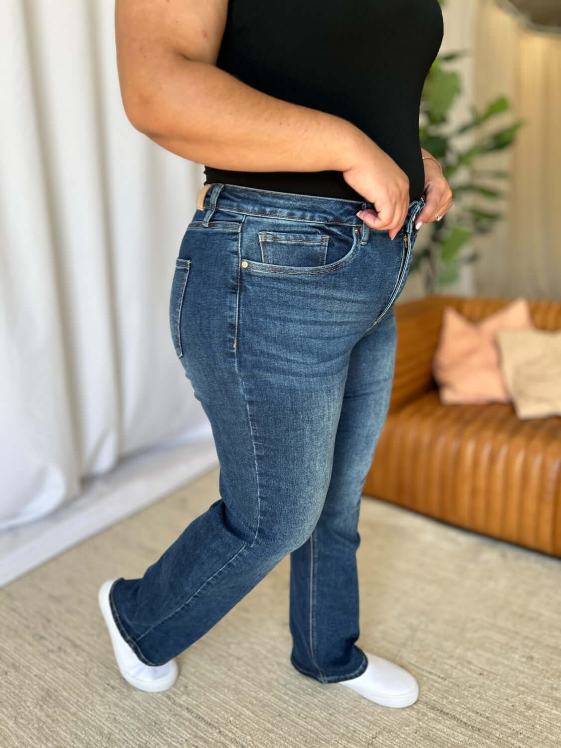 Woman wearing RFM Full Size High Rise Straight Tummy Control Jeans with a classic, flattering high-waist design.