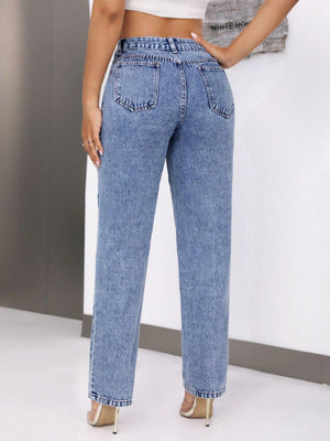 Woman wearing mid-rise waist jeans with pockets, showcasing the back view, made of 85% cotton and 15% polyester, stylish and comfortable fit.