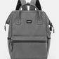 Grey Himawari waterproof backpack with USB port, perfect for travel, featuring durable nylon material and multiple compartments.