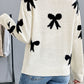 Perfee Bow Graphic Round Neck Sweater with fun bow design, long sleeves, and cozy fit, perfect for a playful wardrobe touch.