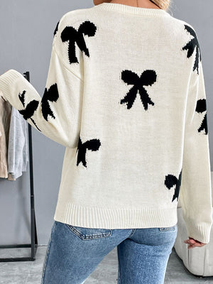 Perfee Bow Graphic Round Neck Sweater with fun bow design, long sleeves, and cozy fit, perfect for a playful wardrobe touch.