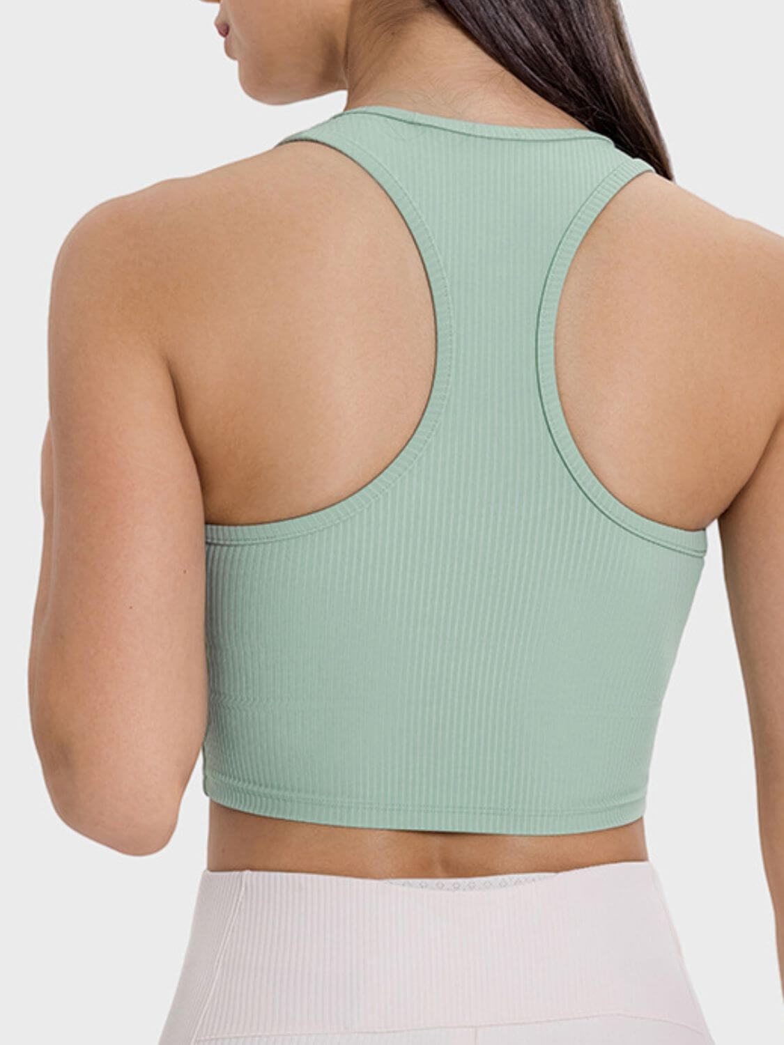 Back view of a mint green scoop neck active tank with wide straps, showcasing moderate stretch and casual style.