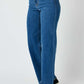 High rise straight Judy Blue Jeans with a streamlined silhouette, paired with casual sneakers for a versatile and flattering look