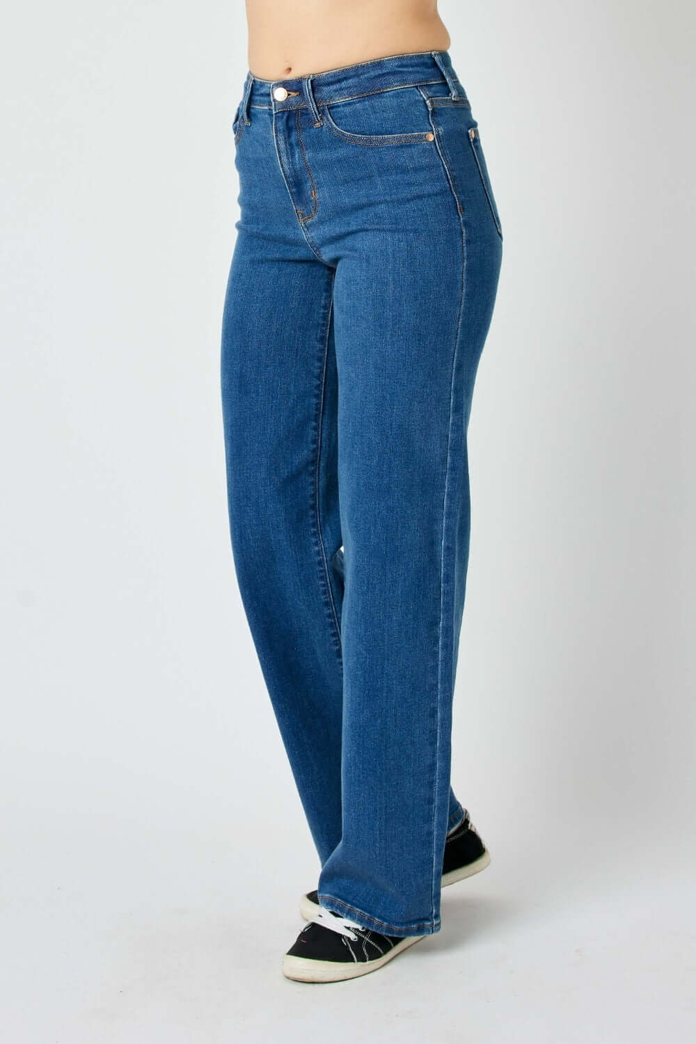 High rise straight Judy Blue Jeans with a streamlined silhouette, paired with casual sneakers for a versatile and flattering look