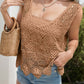 Stylish woman in brown crochet cover-up with casual shorts and woven bag, perfect for beach outings.