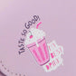 Close-up of Nicole Lee USA Graphic Crossbody Bag with "Taste So Good" and "My Best Drink" pink milkshake graphic design