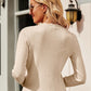 Woman wearing Bella Road Button Up Long Sleeve Cardigan showing back view with ribbed texture