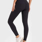 Woman in black Millennia High Stretchy Yoga Leggings showcasing a wide waistband, perfect for comfort and flexibility during workouts.