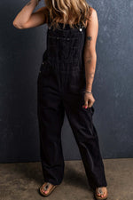 Woman wearing black pocketed straight denim overalls with no stretch, featuring a casual fit and comfortable design for everyday wear.