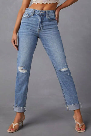 Distressed raw hem straight jeans with pockets, featuring a trendy distressed look and playful raw hem for a chic casual vibe.