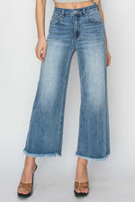 High Rise Raw Hem Cropped Wide Leg Risen Jeans with modern wide leg silhouette and trendy cropped length