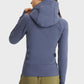 Back view of Millennia Zip Up Seam Detail Hooded Sports Jacket in blue, showcasing its stylish design and cozy hood.