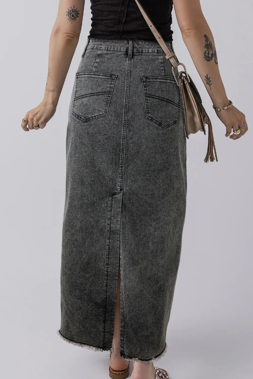 Stylish back view of Bella Road Raw Hem Midi Denim Skirt with Pockets, showcasing edgy raw hem and comfy pockets for essentials.