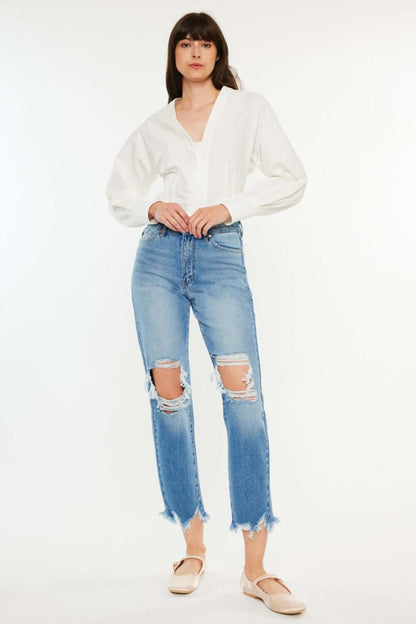 Stylish distressed frayed hem cropped jeans for a chic casual look, paired with a white top and flats, showcasing trendy ripped details.