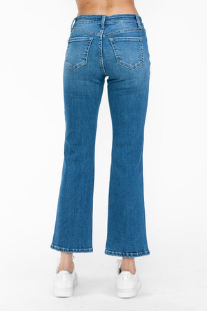 Back view of bytos Cat's Whiskers Mid Rise Ankle Jeans showcasing a stylish, flared silhouette in vibrant blue denim.