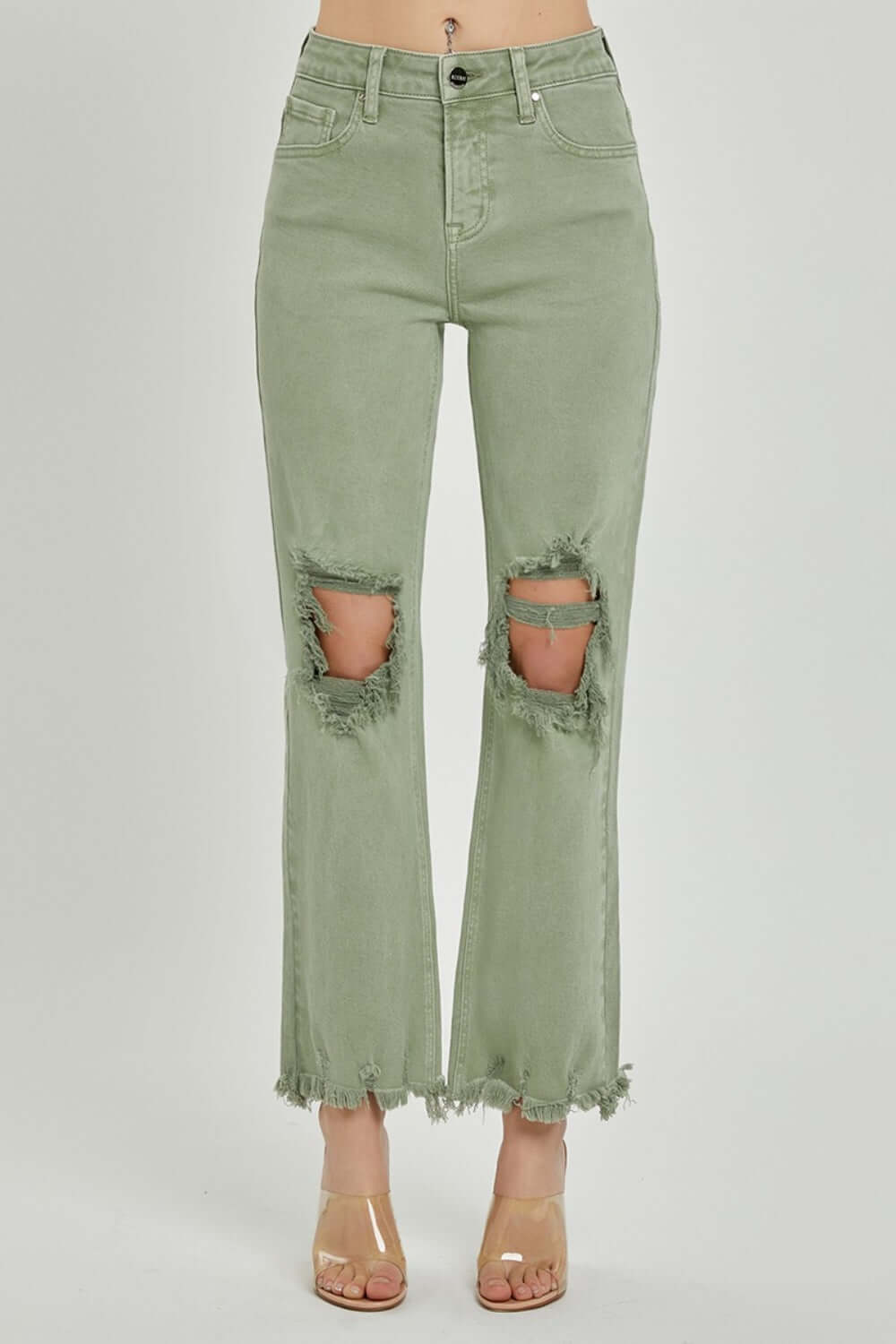 Distressed green bootcut jeans by Risen Jeans with frayed hems and ripped knees showcase a flattering and elongating retro silhouette.