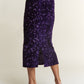 Sparkling purple sequin back slit midi skirt for special occasions, offering glamour and allure with every step.