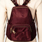 Burgundy multi pocket nylon backpack bag showcasing stylish design and practical storage on a mannequin.