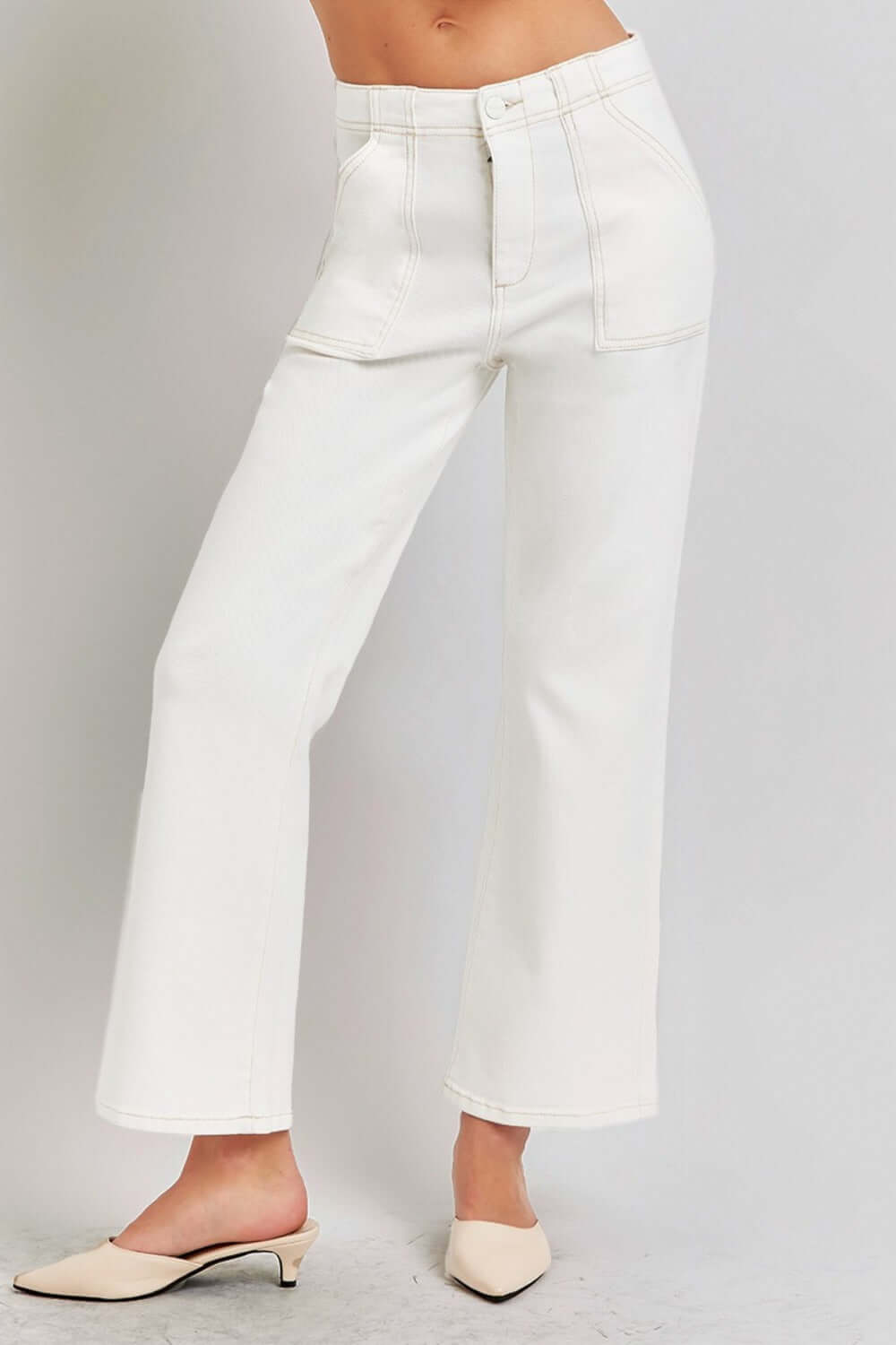 High-rise white ankle flare jeans with patch pockets, showcasing a chic, flattering silhouette and retro style charm.