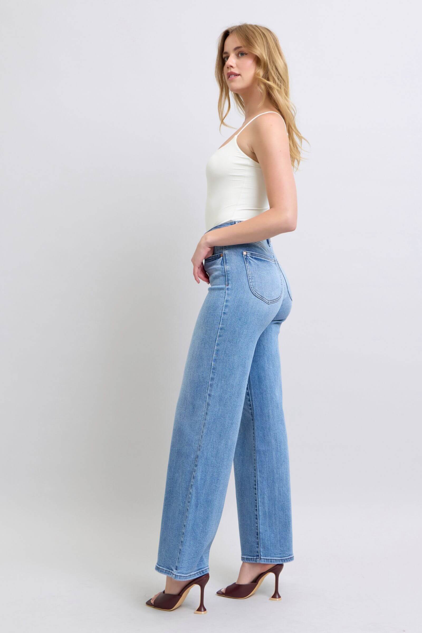 Judy Blue wide leg jeans with pockets, showcased on model, perfect for stylish and relaxed outfits.