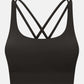 Crisscross scoop neck active tank in black, showcasing stylish design and comfort for workouts.