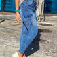 Model showcasing Bella Road Denim Skinny Jeans with pockets in medium wash, perfect for chic casual style.