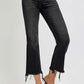 Trendy plus size raw hem cropped flare jeans with a stylish black wash and casual vibe.