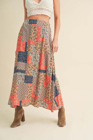 Stylish Aemi + Co Printed Maxi Skirt with bold patterns, perfect for summer outfits and versatile styling options.