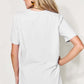 Woman wearing MAMA round neck short sleeve T-shirt with a basic style and slightly stretchy material, view from the back.