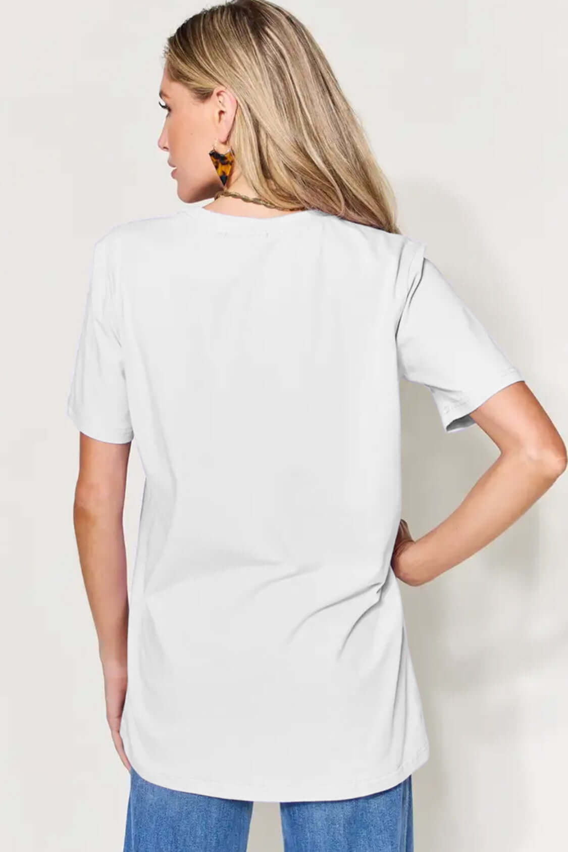 Woman wearing MAMA round neck short sleeve T-shirt with a basic style and slightly stretchy material, view from the back.