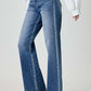 High waist jeans with pockets displayed in a stylish outfit, offering a flattering silhouette and trendy look.