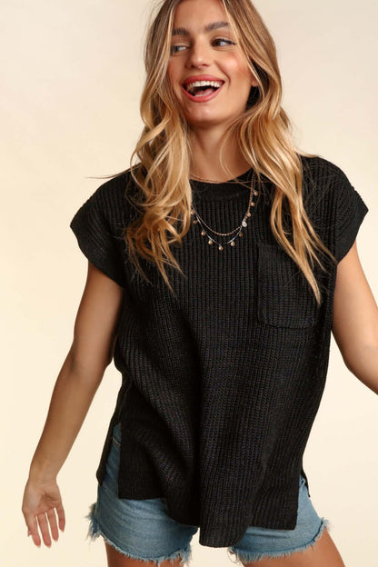 Woman wearing a black Pocketed Round Neck Cap Sleeve Knit Top paired with denim shorts, showcasing casual chic style.