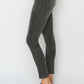 High Rise Ankle Skinny Jeans highlighting a woman's legs and curves, featuring a slim fit and high-waisted design for an elongated silhouette.