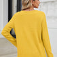 Back view of woman wearing Bella Road waffle-knit notched long sleeve T-shirt in yellow, showcasing casual style and comfort.