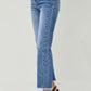 High Waist Raw Hem Slit Straight Risen Jeans styled with black heels for a trendy look.