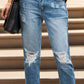 Woman wearing distressed raw hem jeans with pockets, featuring slightly stretchy material for a comfortable fit.